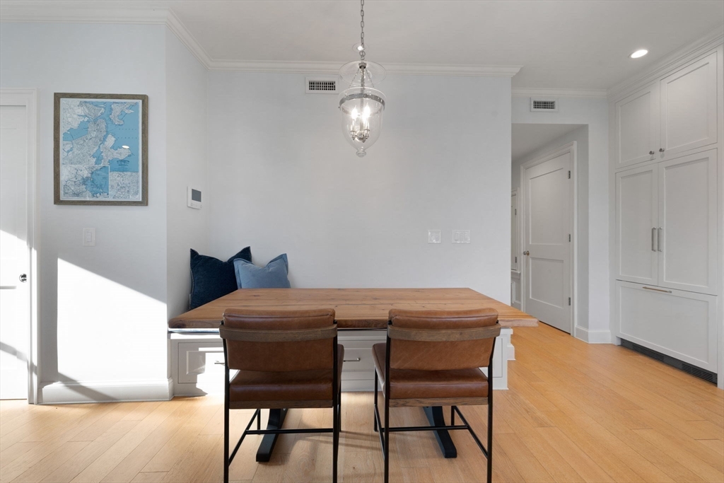 38 P Street, Unit 3 Boston, MA 02127 - Photo 6 of 30 a view of a dining room with furniture and wooden floor