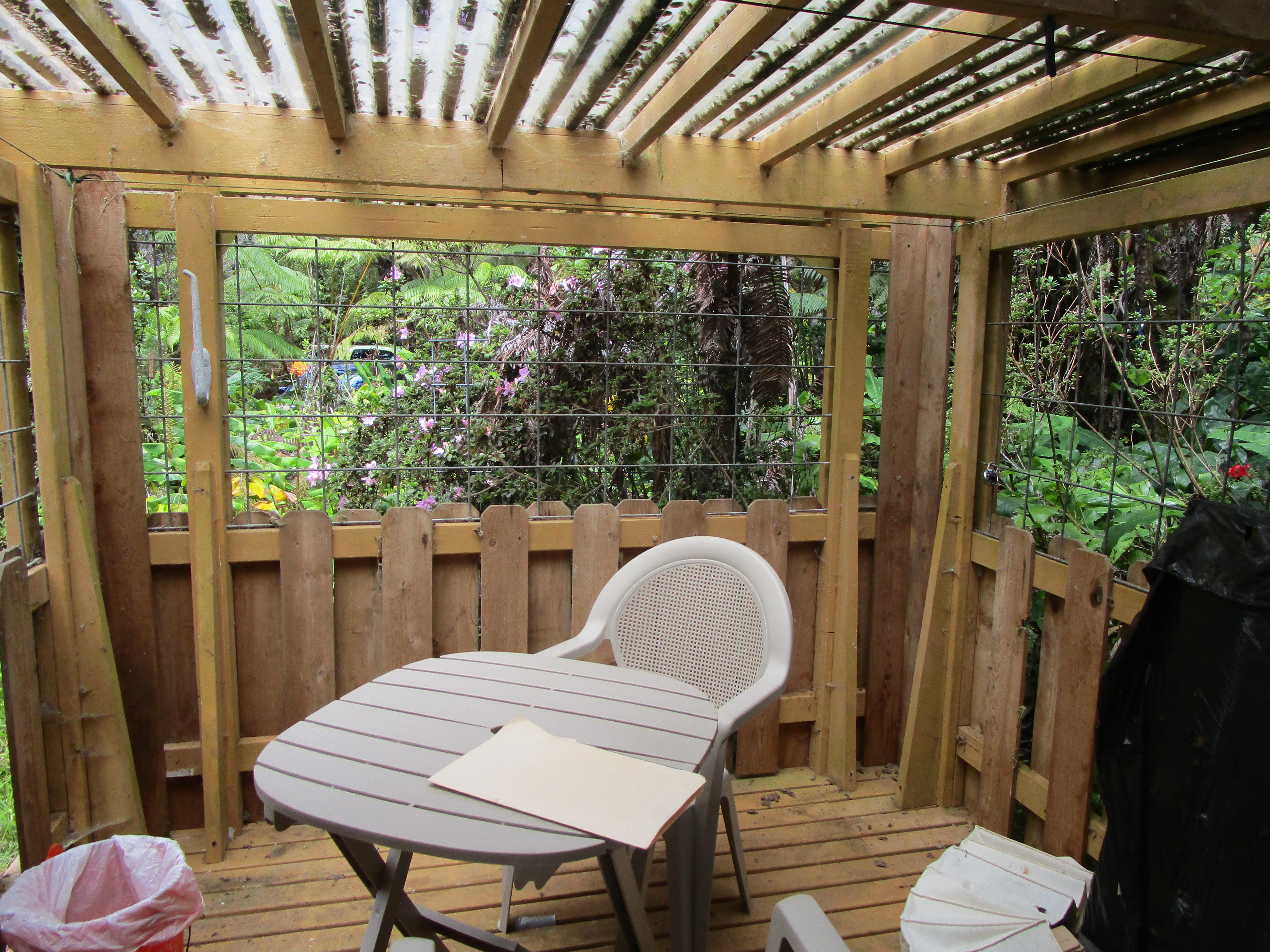 1 Alanui Iiwi Volcano, HI 96785 - Photo 8 of 22 a view of balcony with wooden floor and outdoor seating