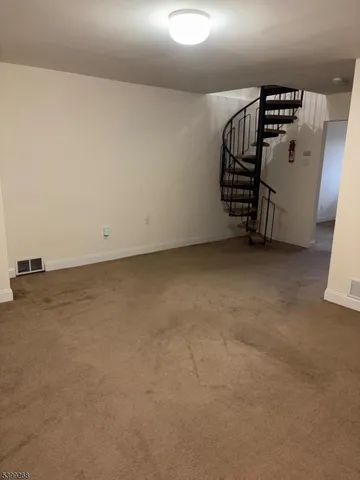 a view of a yard with wooden fence