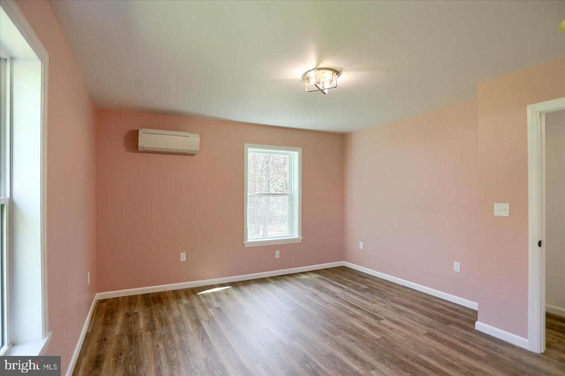 3497 New Lancaster Valley Road Milroy, PA 17063 - Photo 16 of 30 an empty room with wooden floor chandelier and windows