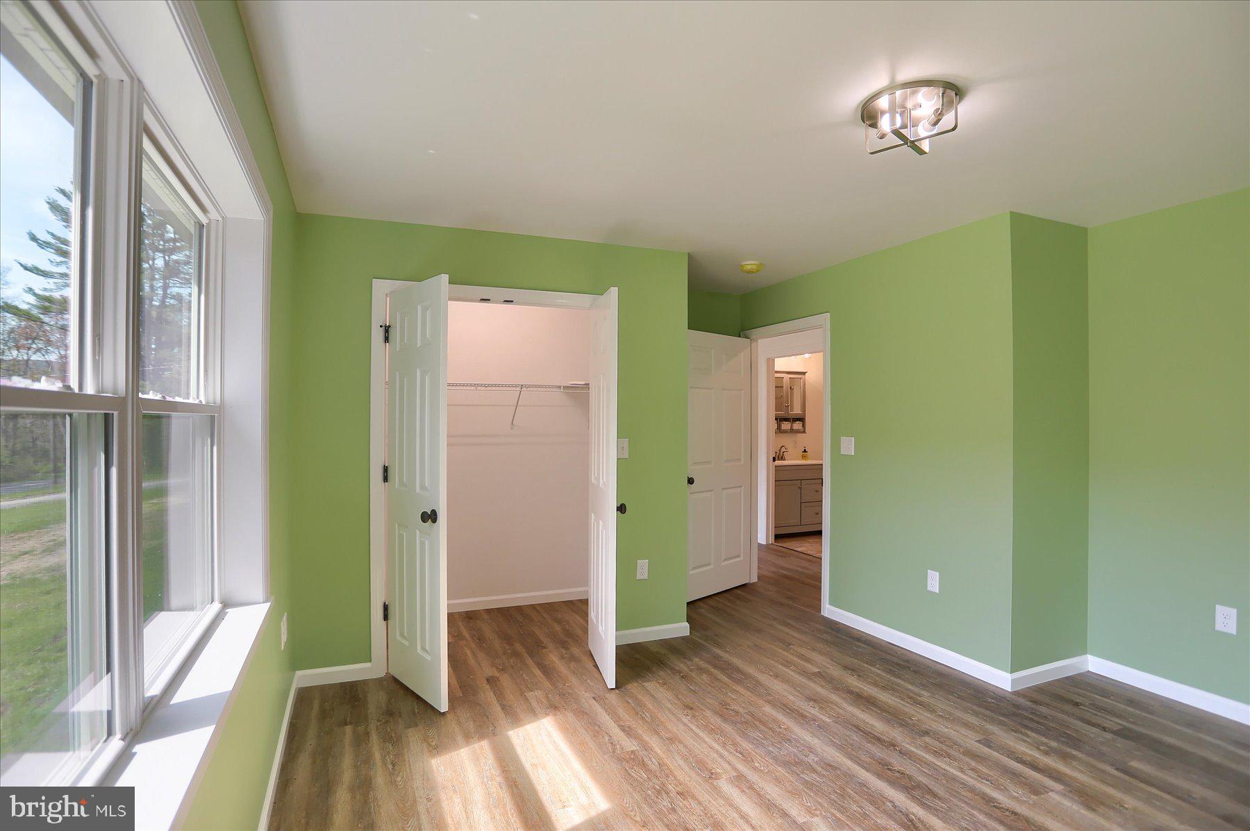 3497 New Lancaster Valley Road Milroy, PA 17063 - Photo 17 of 30 a view of a room with wooden floor and a window
