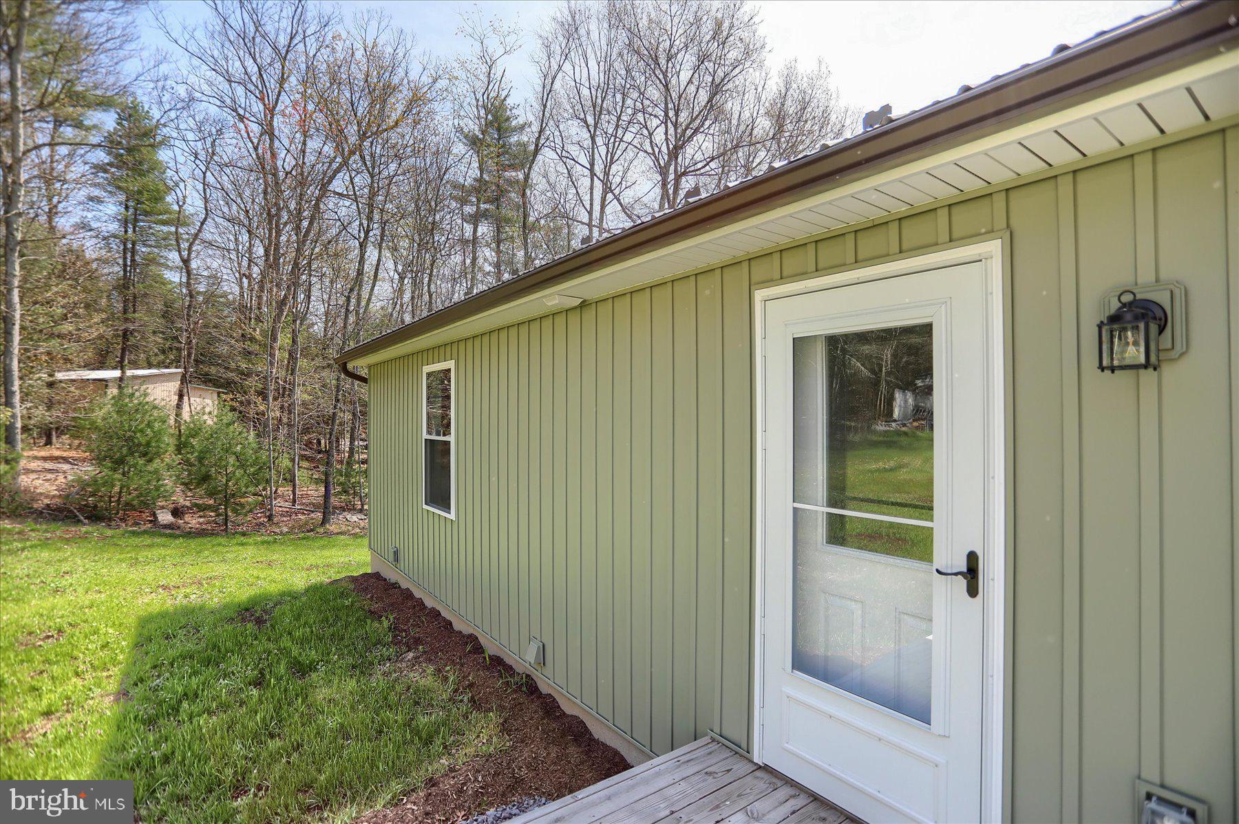 3497 New Lancaster Valley Road Milroy, PA 17063 - Photo 4 of 30 a view of a back yard of the house