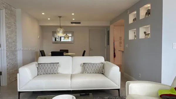 a large white couch sitting in a living room