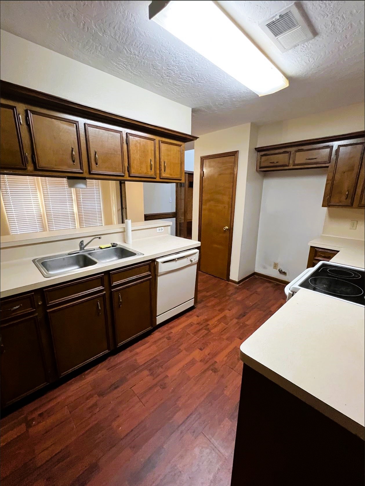 102 Briar Ridge Drive Bellville, TX 77418 - Photo 5 of 15 a kitchen with a sink a stove and refrigerator