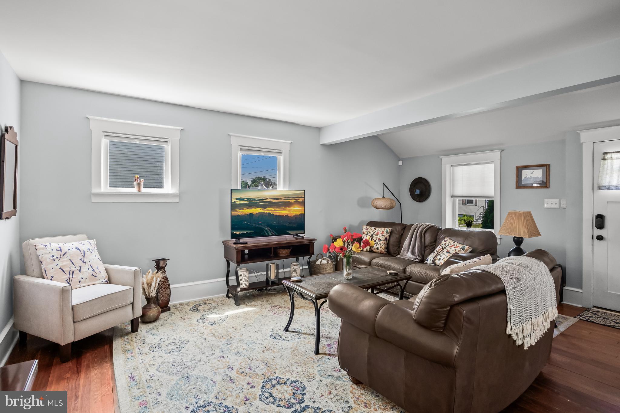 615 North Walnut Avenue Magnolia, NJ 08049 - Photo 6 of 40 a living room with furniture and a flat screen tv