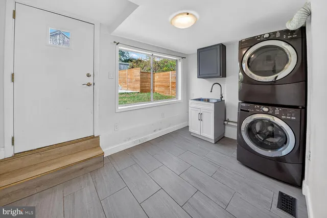 a view of a hallway with washer and dryer