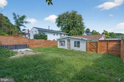 a backyard of a house with lots of green space