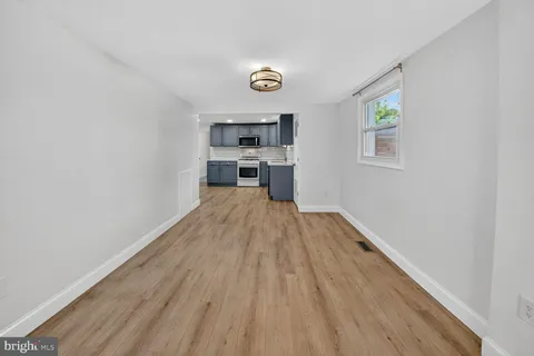 a view of a kitchen from the hallway