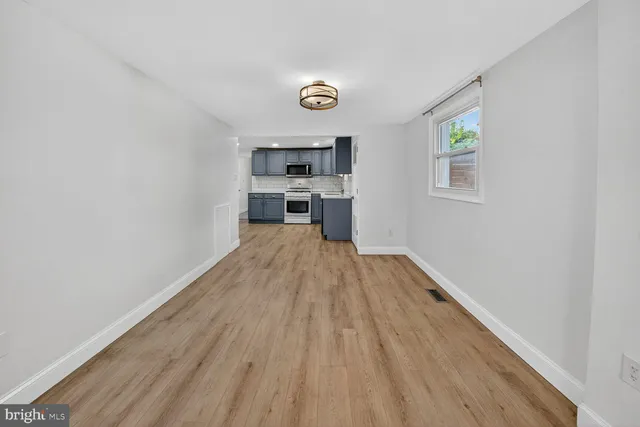 a view of a kitchen from the hallway