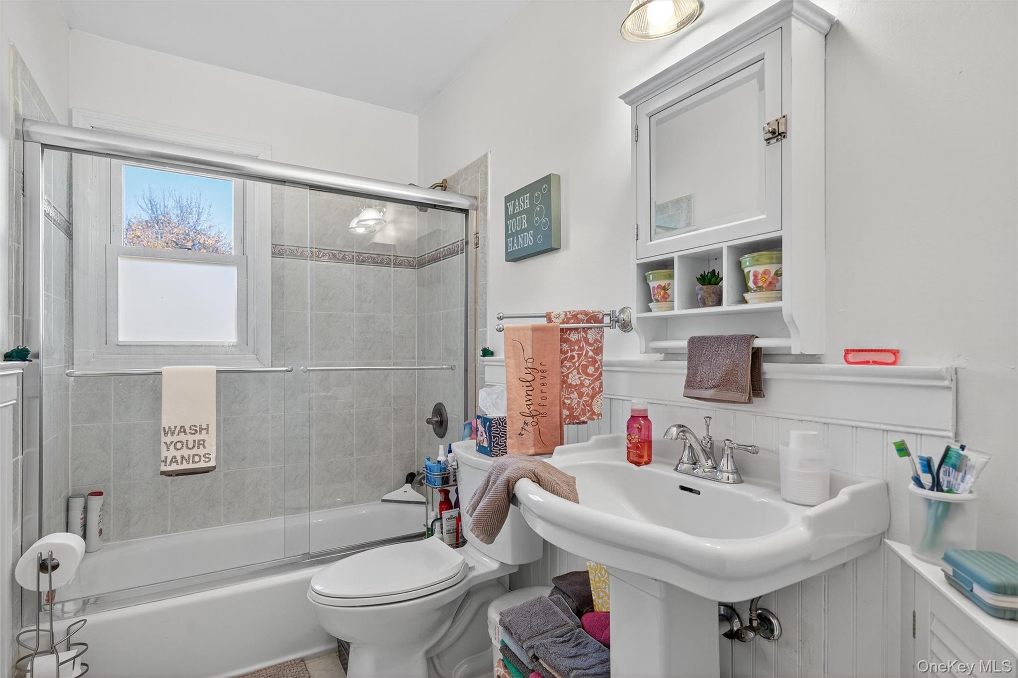 76 Pine Hill Road Highland Mills, NY 10930 - Photo 18 of 41 Full bathroom featuring shower / bath combination with glass door and wainscoting