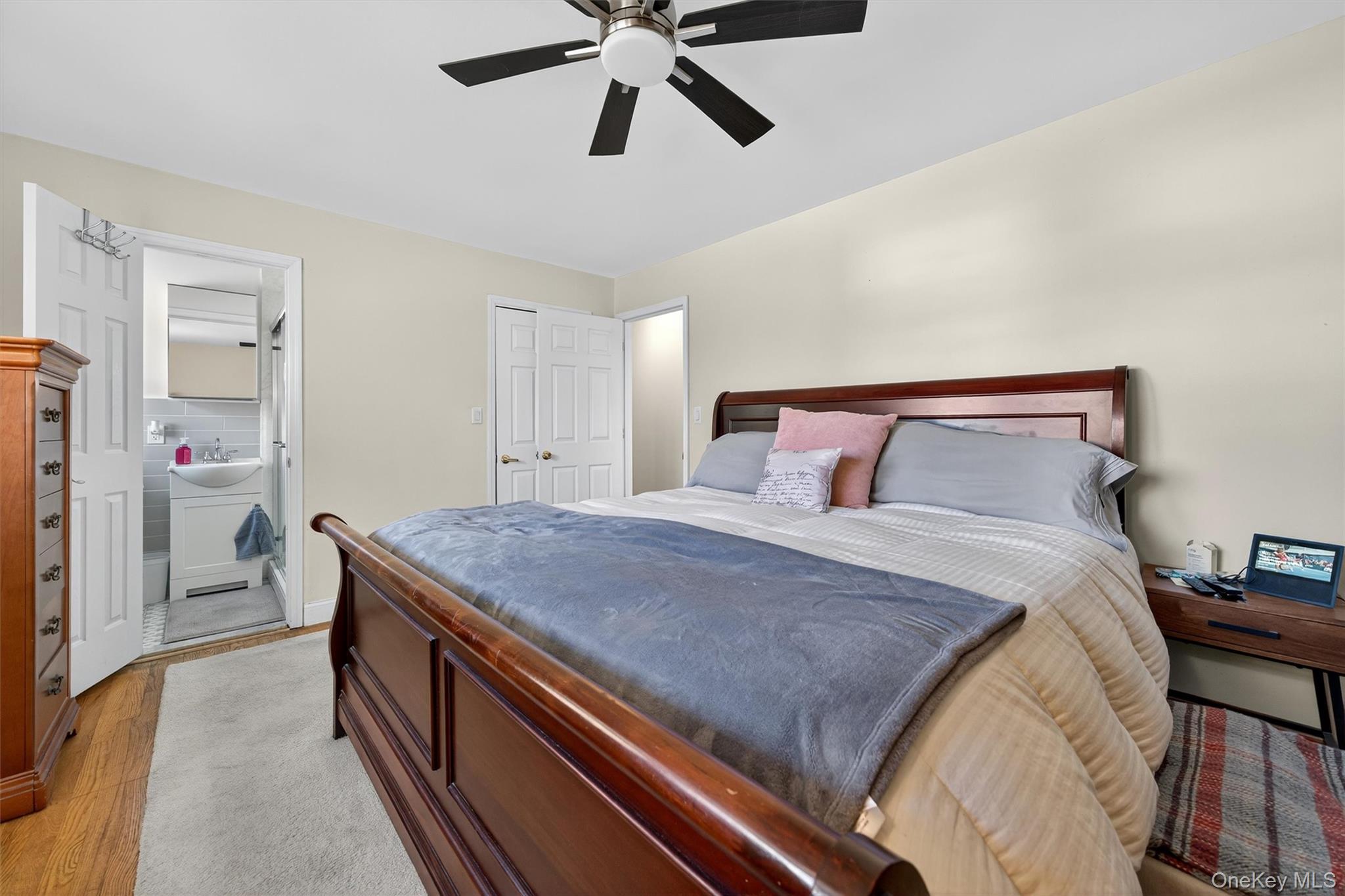 76 Pine Hill Road Highland Mills, NY 10930 - Photo 20 of 41 Bedroom with light wood-style floors, ceiling fan, and ensuite bathroom