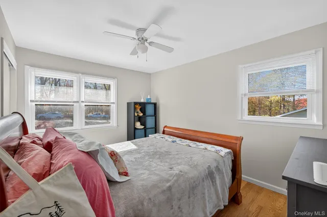 a bedroom with a large bed and a window