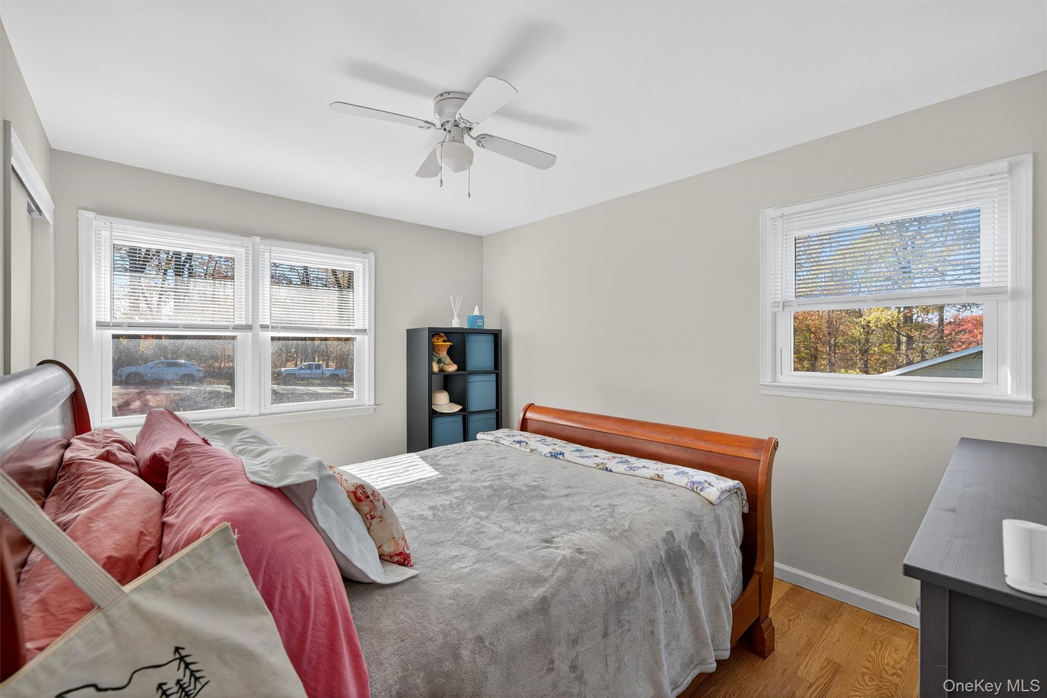 76 Pine Hill Road Highland Mills, NY 10930 - Photo 22 of 41 Bedroom with wood finished floors, multiple windows, and a ceiling fan