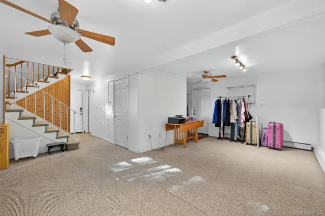 a bathroom with a sink mirror and toilet