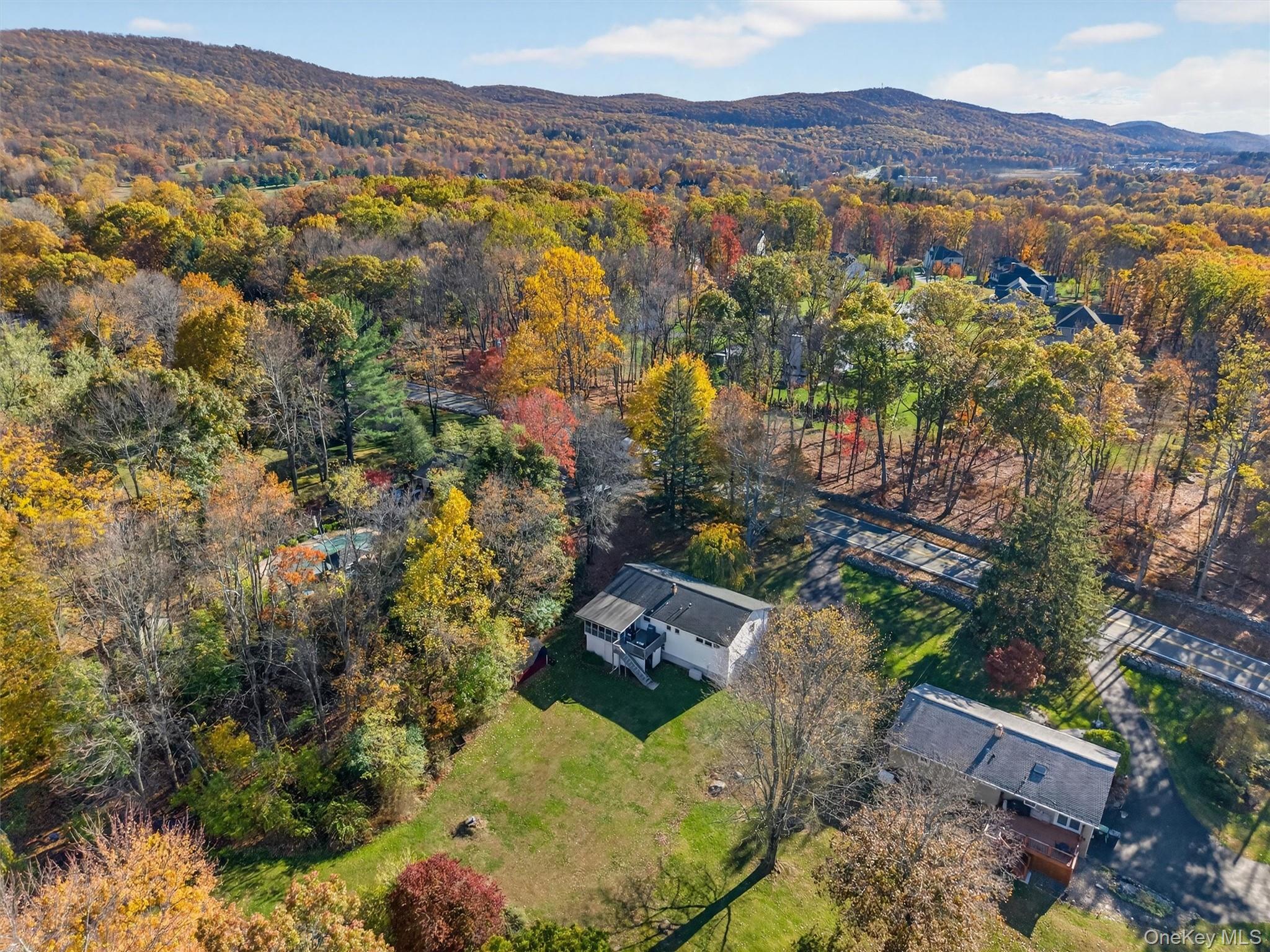 76 Pine Hill Road Highland Mills, NY 10930 - Photo 38 of 41 Drone / aerial view of a forest and a mountain backdrop