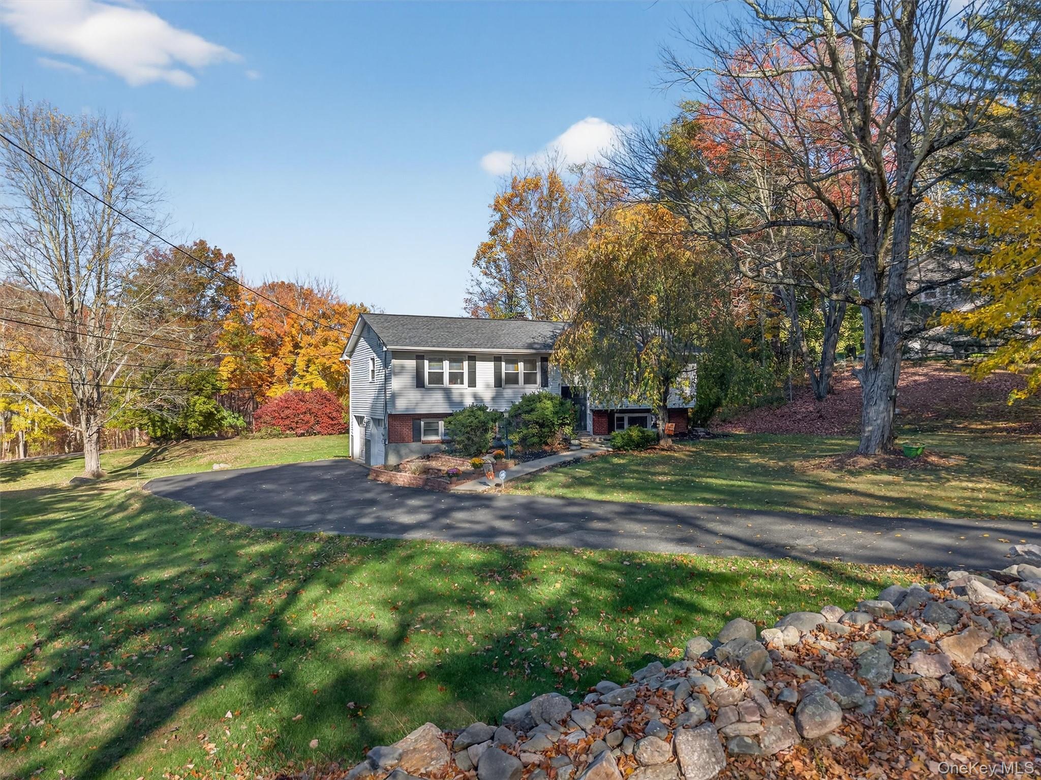 76 Pine Hill Road Highland Mills, NY 10930 - Photo 5 of 41 View of front of home with a front lawn, driveway, and a garage