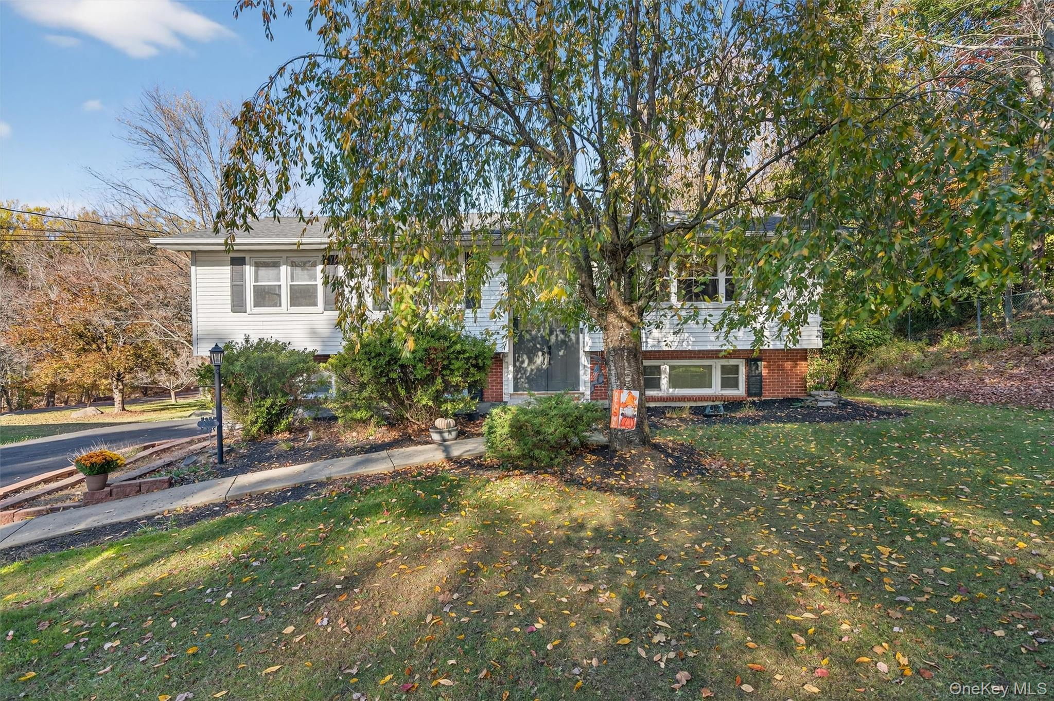 76 Pine Hill Road Highland Mills, NY 10930 - Photo 7 of 41 Raised ranch with a front yard and brick siding