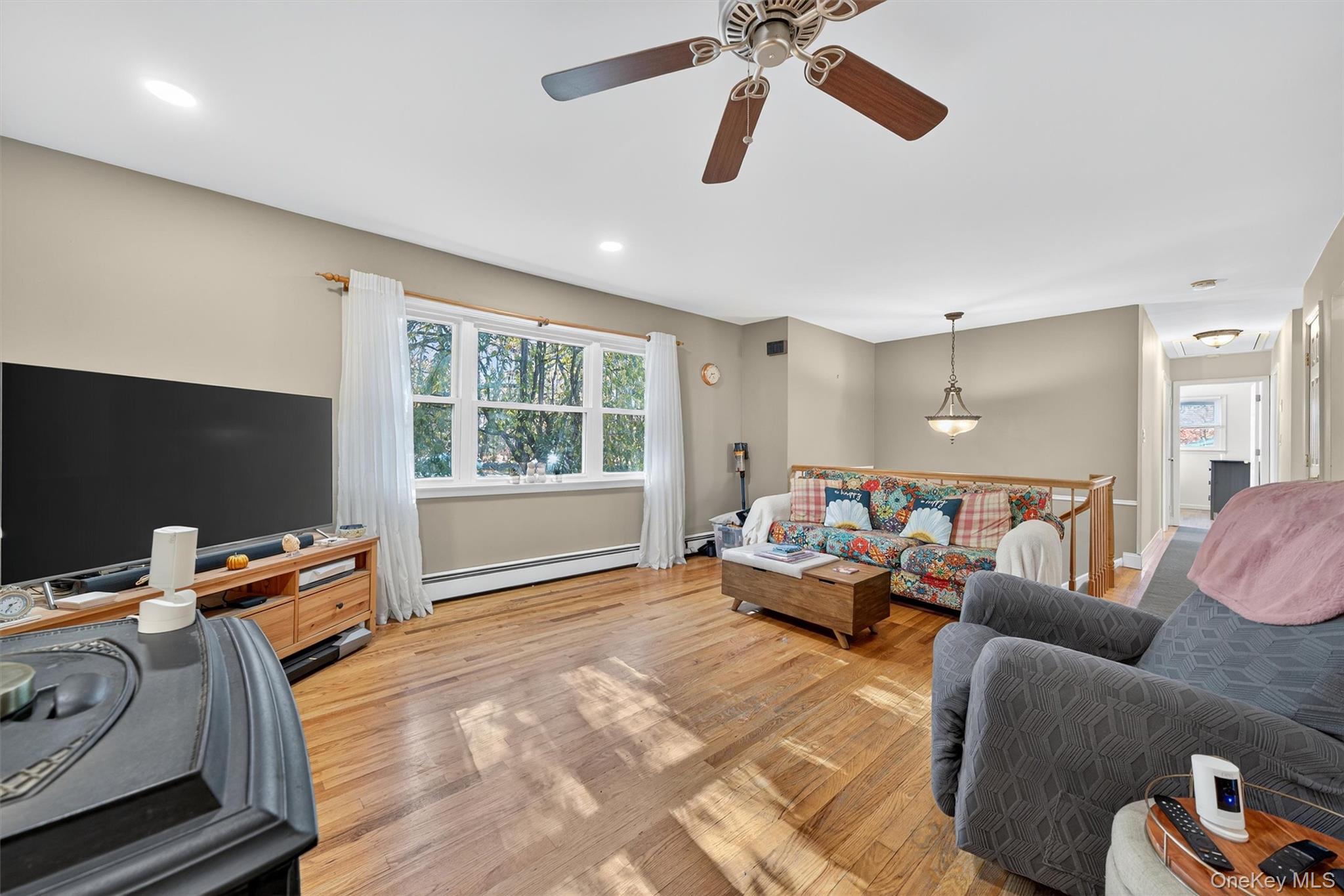 76 Pine Hill Road Highland Mills, NY 10930 - Photo 10 of 41 Living area featuring wood finished floors, a ceiling fan, and recessed lighting