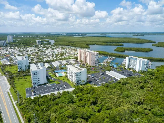 a view of a swimming pool with a yard