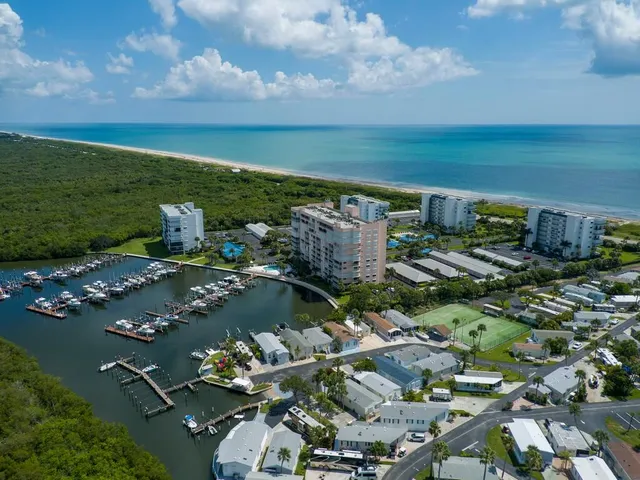 an aerial view of a houses with outdoor space