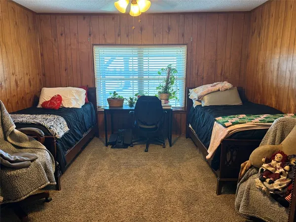 a living room with furniture and a lamp