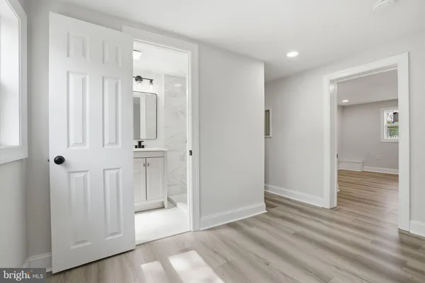 wooden floor with white walls