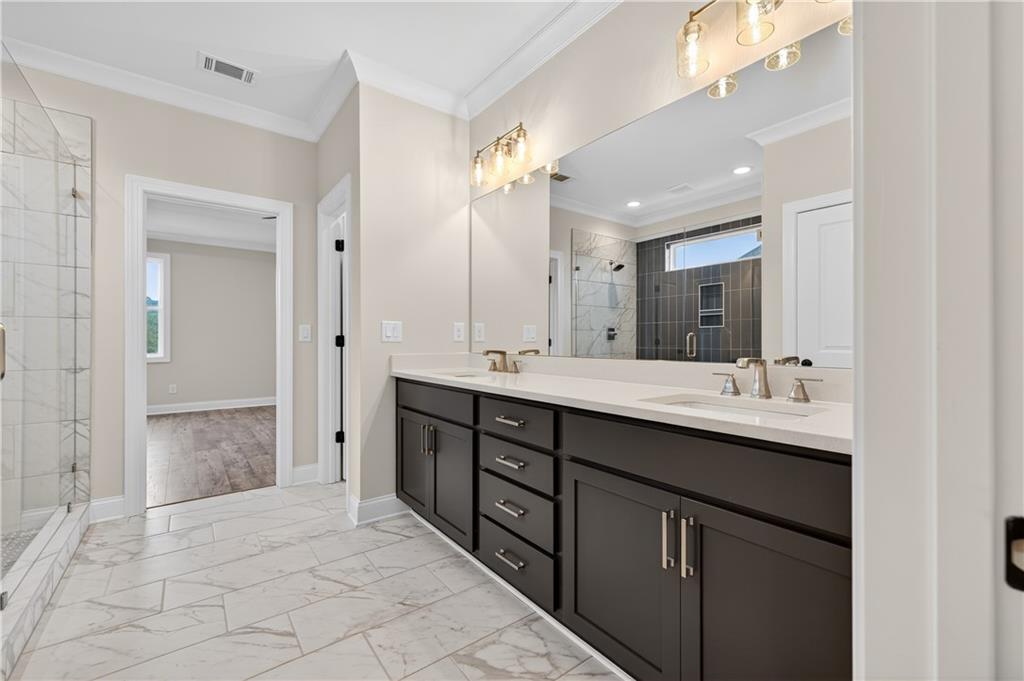 3787 Cheyenne Lane Jefferson, GA 30549 - Photo 46 of 82 a bathroom with a double vanity sink mirror and next to a window