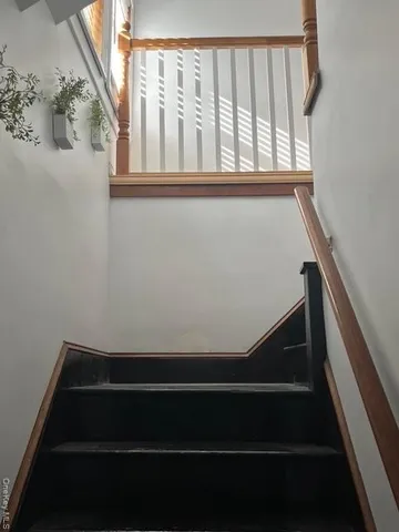 wooden floor in a living room with a window