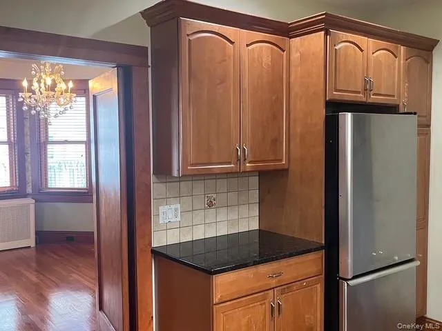 a kitchen with counter top space a sink and appliances