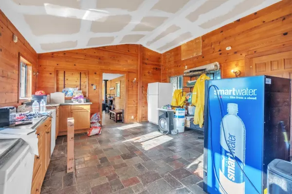 a bathroom with a shower and a sink