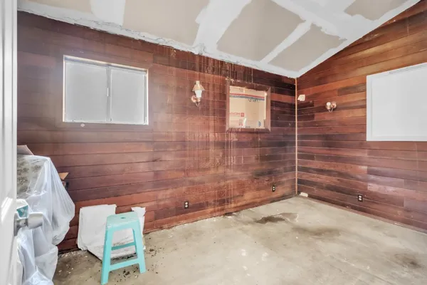 a bathroom with a sink mirror and toilet