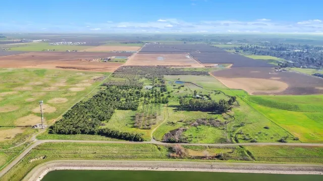 a view of a pathway both side of grassy field