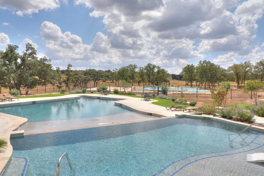 379 Inspiration Loop Comfort, TX 78013 - Photo 25 of 27 a view of a swimming pool and city from a terrace