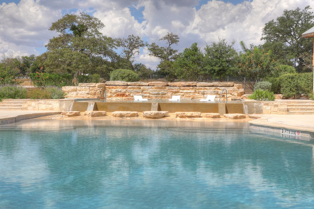 379 Inspiration Loop Comfort, TX 78013 - Photo 26 of 27 a view of yard with swimming pool and lake in background