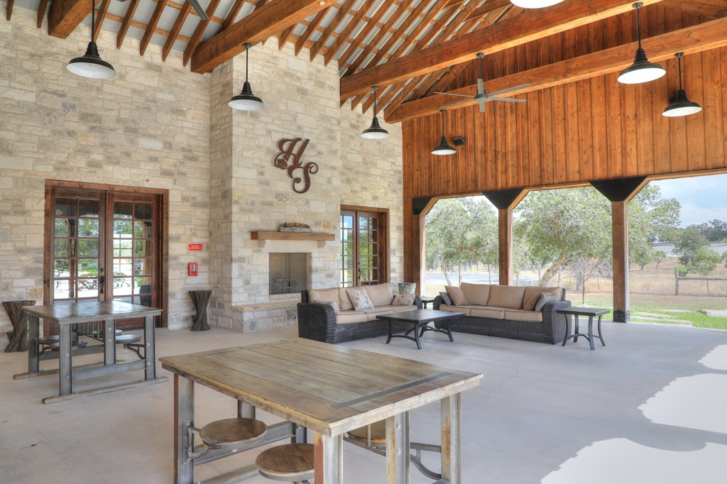 379 Inspiration Loop Comfort, TX 78013 - Photo 3 of 27 a living room with furniture a fireplace and large windows