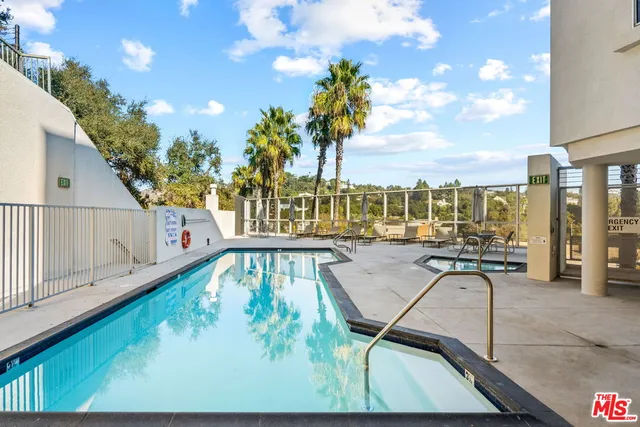 a view of swimming pool with furniture