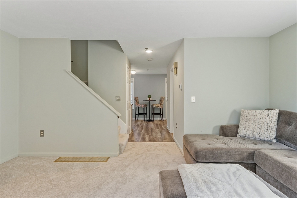 278 Manning Street, Unit 603 Hudson, MA 01749 - Photo 12 of 34 a living room with furniture and entryway