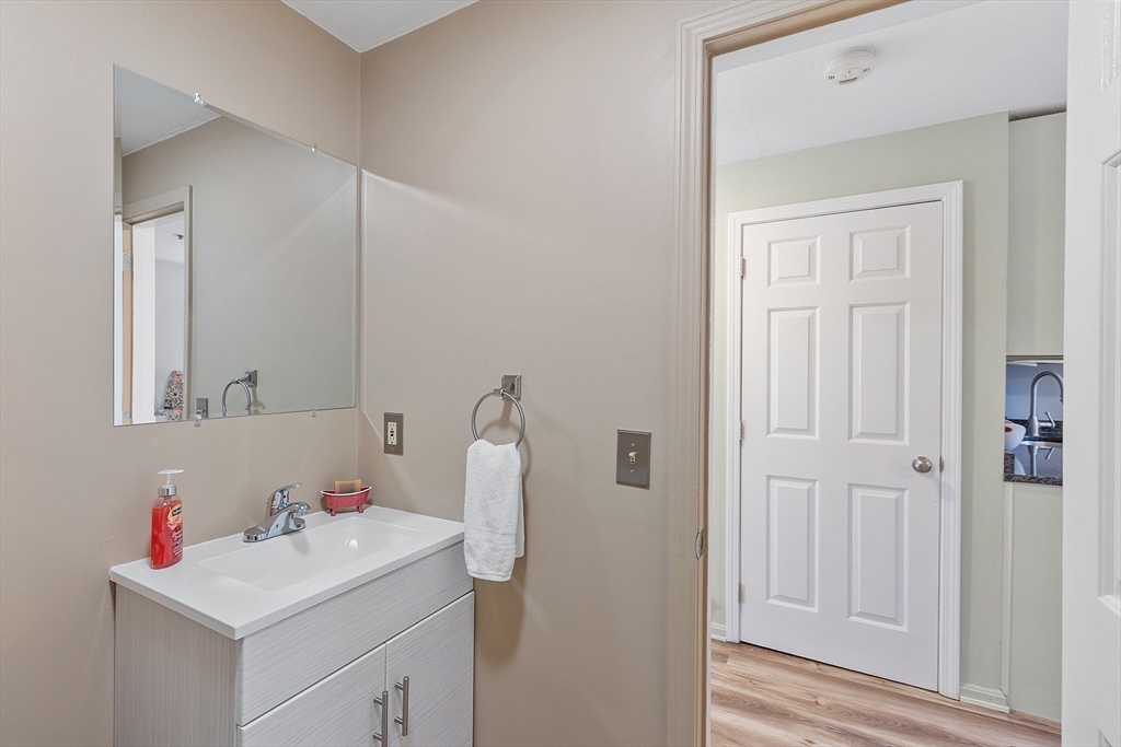 278 Manning Street, Unit 603 Hudson, MA 01749 - Photo 13 of 34 a bathroom with a sink vanity and a mirror