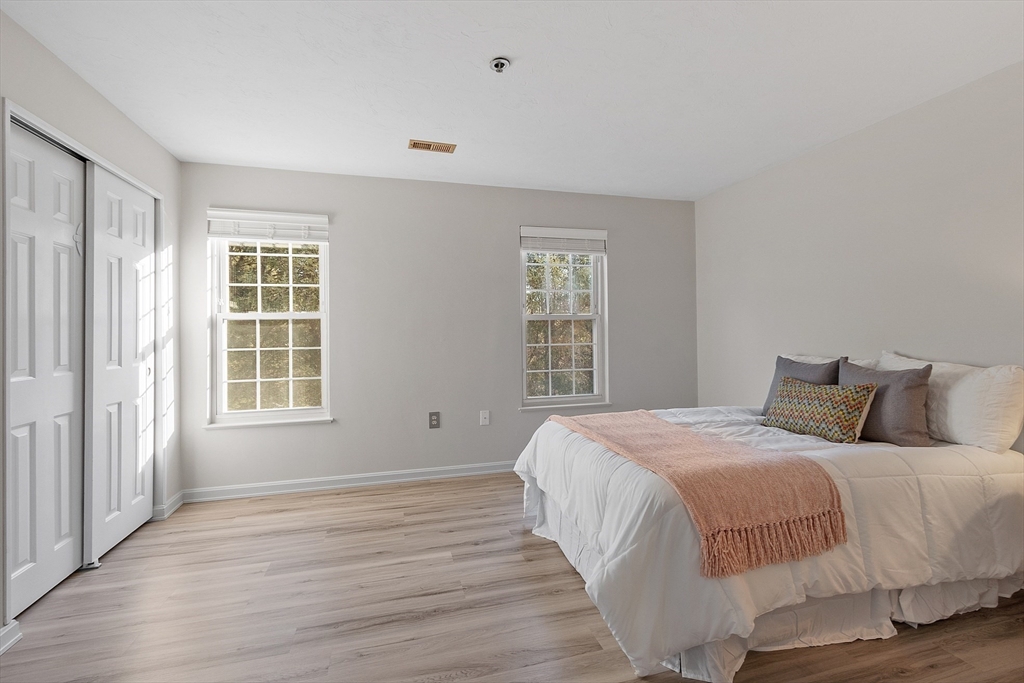 278 Manning Street, Unit 603 Hudson, MA 01749 - Photo 14 of 34 a bedroom with a bed and a window