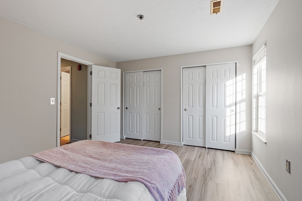 278 Manning Street, Unit 603 Hudson, MA 01749 - Photo 17 of 34 a bedroom with a bed and a window