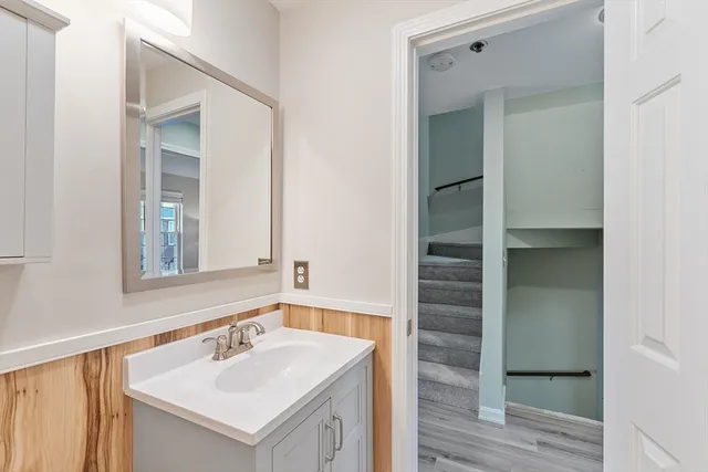 a bathroom with a sink and a mirror