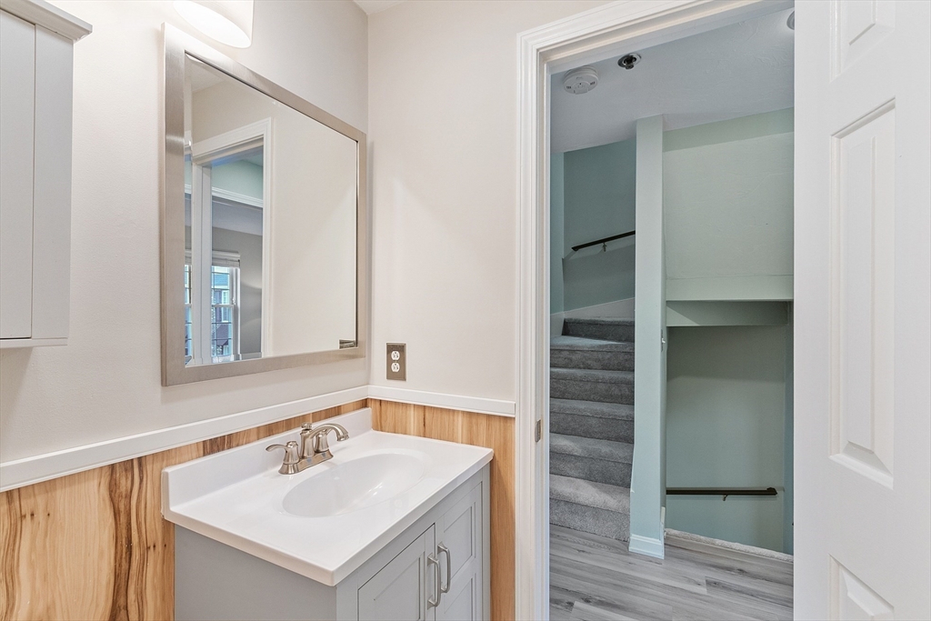 278 Manning Street, Unit 603 Hudson, MA 01749 - Photo 22 of 34 a bathroom with a sink and a mirror