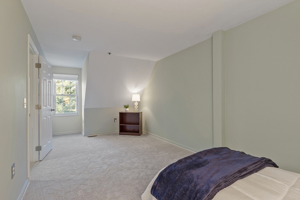 278 Manning Street, Unit 603 Hudson, MA 01749 - Photo 25 of 34 a bedroom with a bed and a window