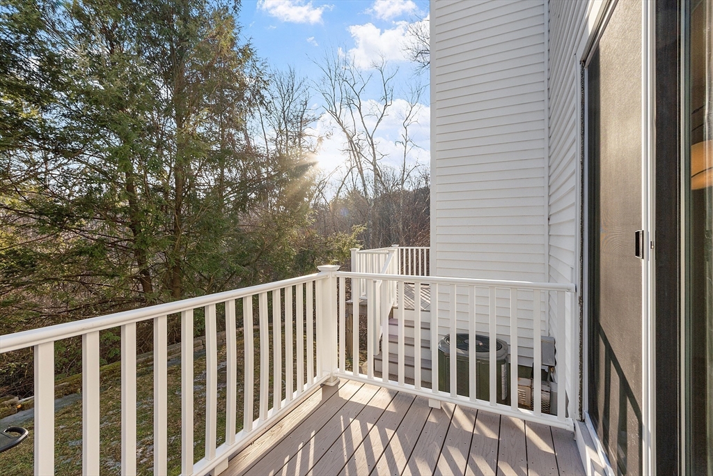 278 Manning Street, Unit 603 Hudson, MA 01749 - Photo 28 of 34 a view of a wooden fence