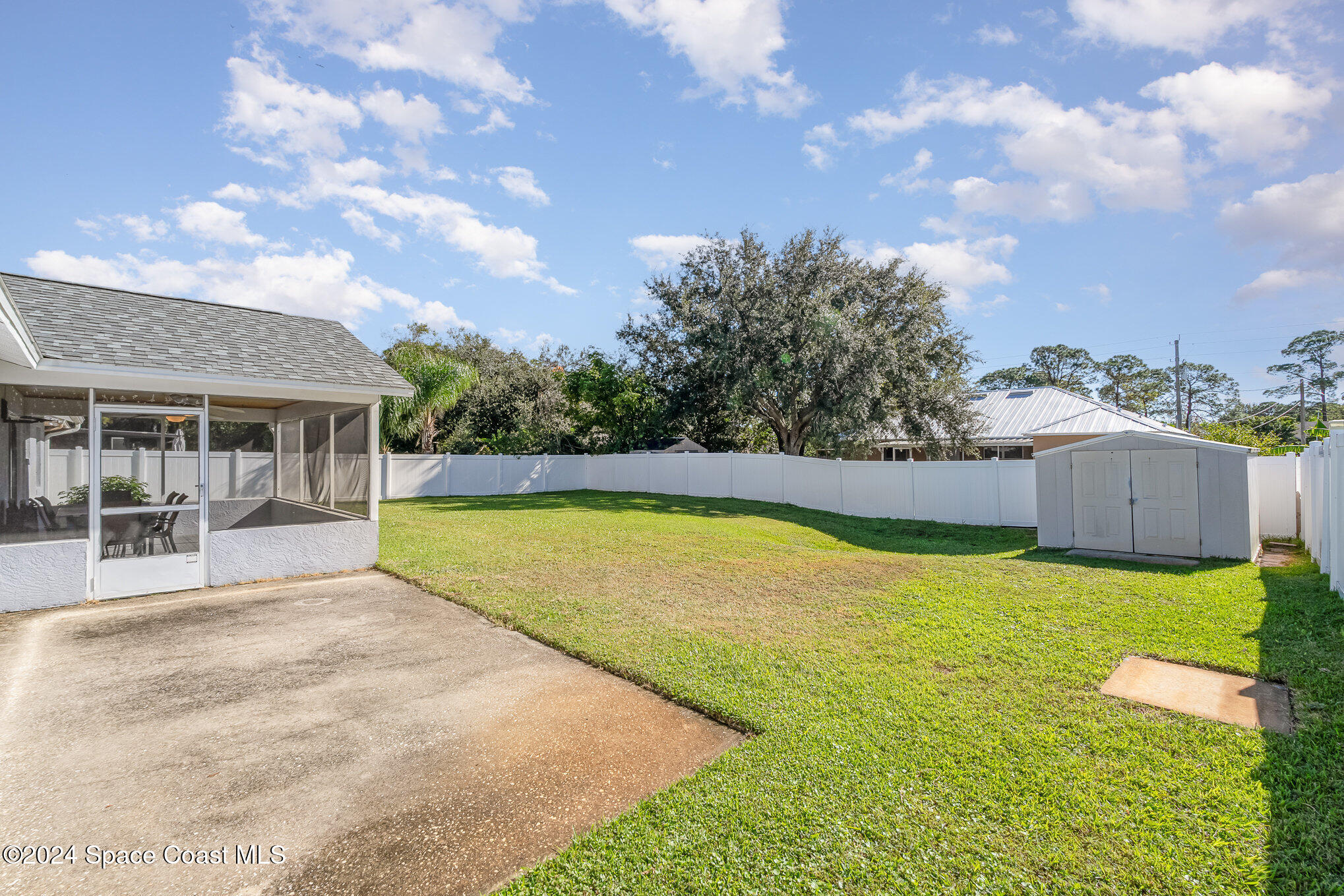 6333 Irving Road Cocoa, FL 32927 - Photo 2 of 26 a view of an house with swimming pool and yard