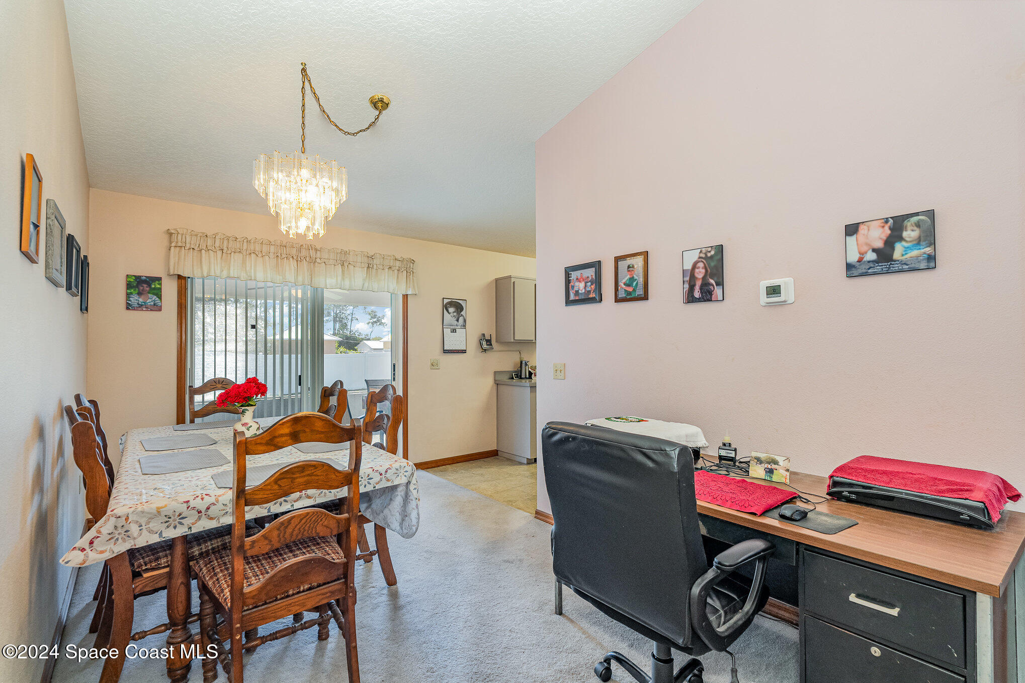 6333 Irving Road Cocoa, FL 32927 - Photo 6 of 26 a view of a dining room with furniture and chandelier