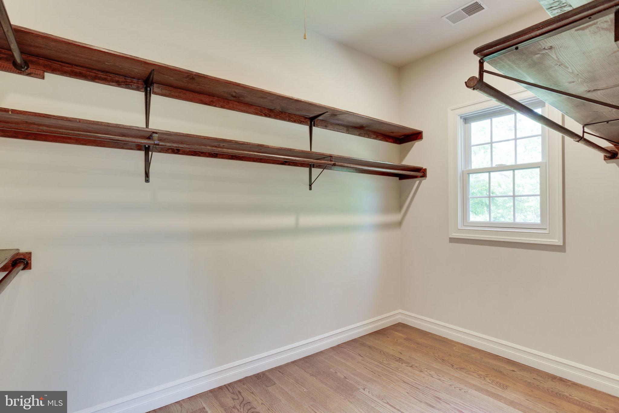 1843 Hunter Mill Road Vienna, VA 22182 - Photo 42 of 78 Master bedroom walk-in closet w/ window
