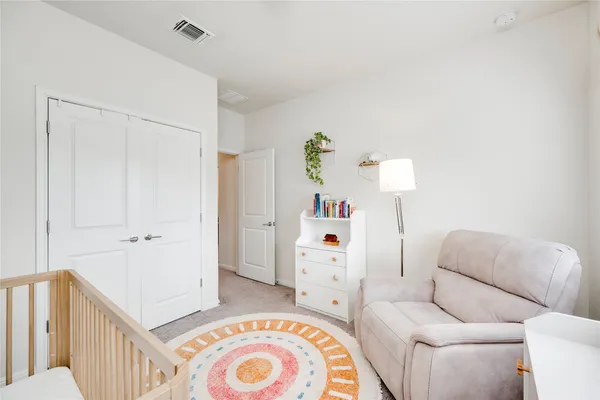 a bedroom with furniture and a window
