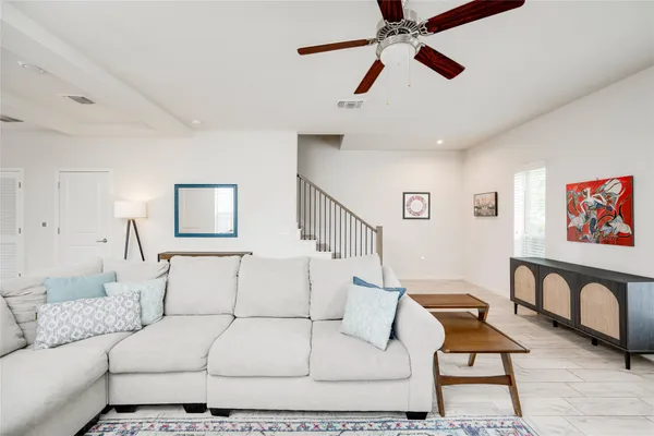 a living room with furniture and a rug