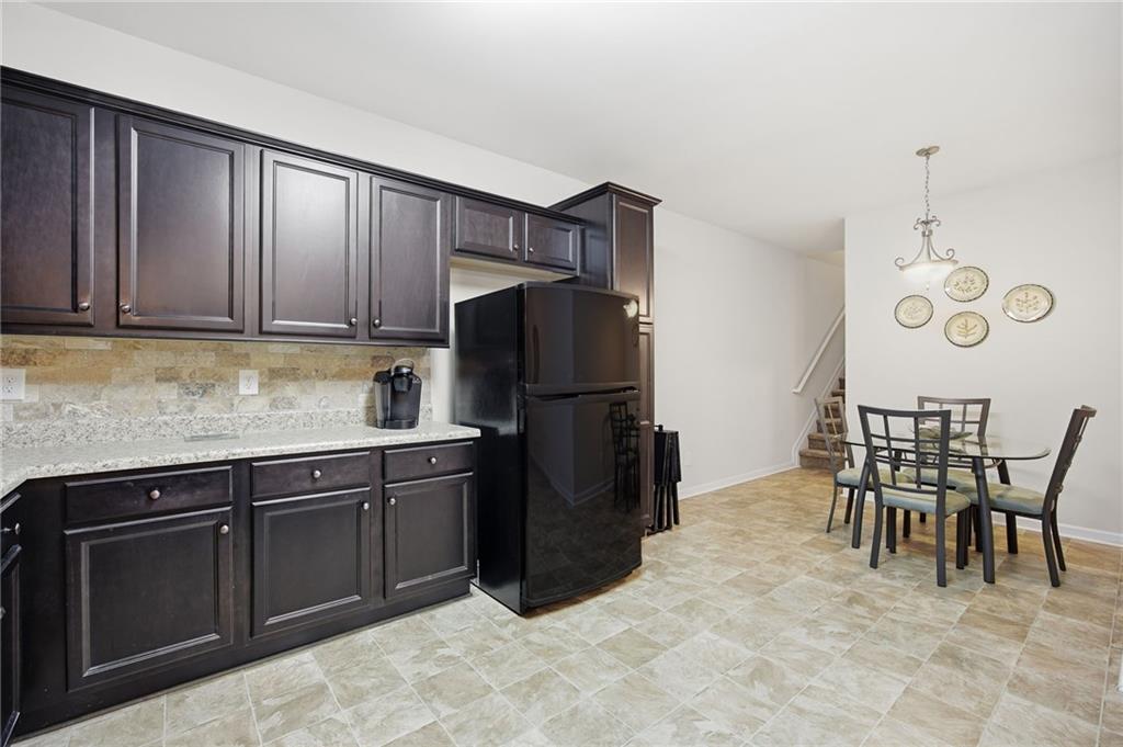 2403 Tree Arbor Way Marietta, GA 30064 - Photo 13 of 25 a kitchen with a refrigerator and a table